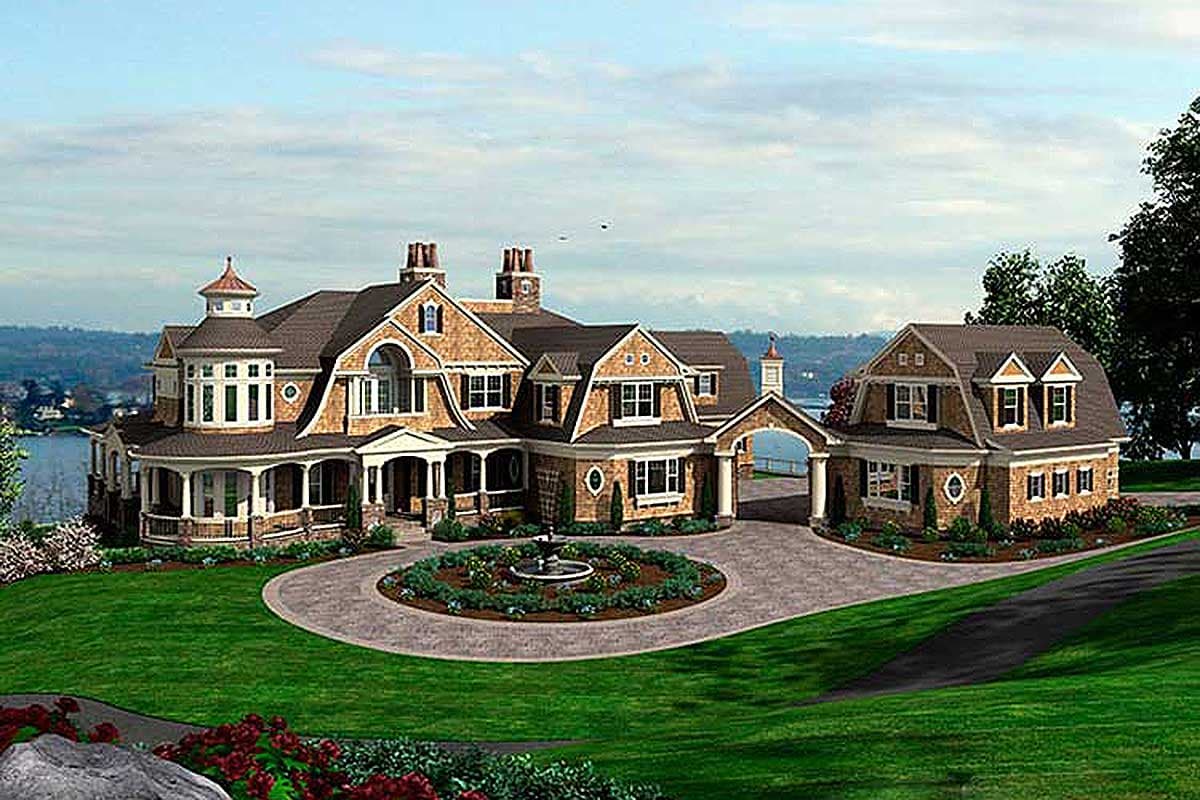 House plan exterior: complex shingle-clad structure with turret, multiple gables, arched windows, and covered porch.