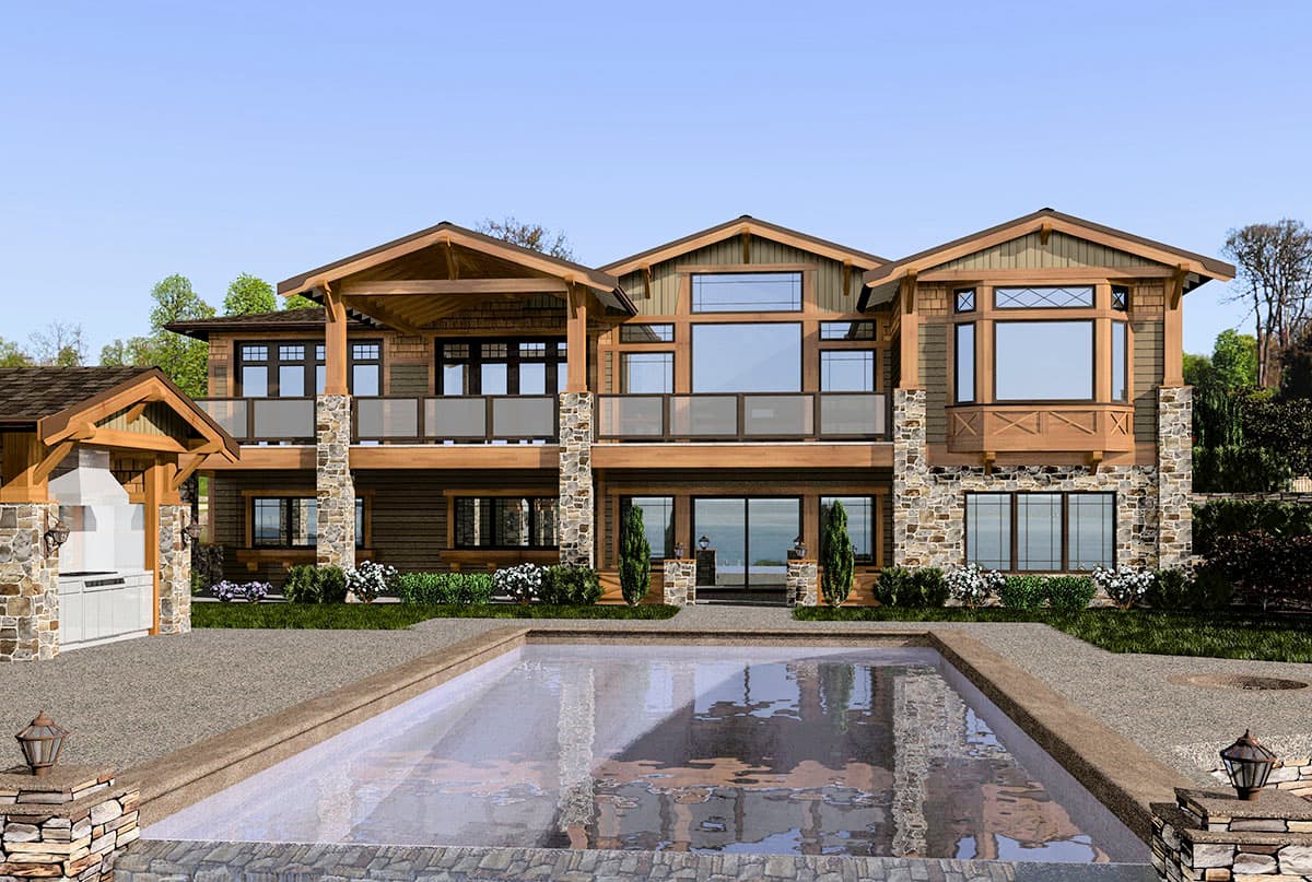 House plan exterior: two-story Modern Craftsman with stone accents, multiple gables, covered balconies, and an outdoor kitchen.