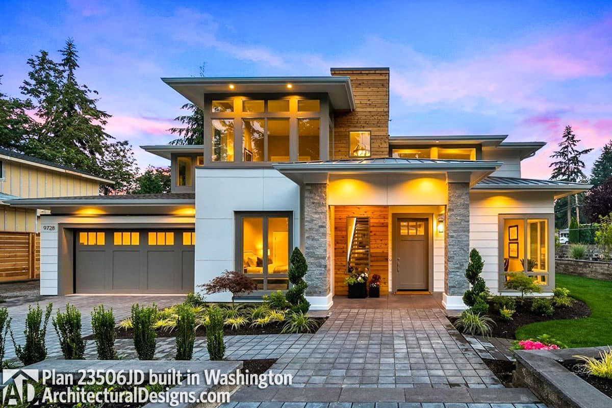 Modern house plan exterior with a two-car garage, multiple gables, stone accents, and a covered entryway.