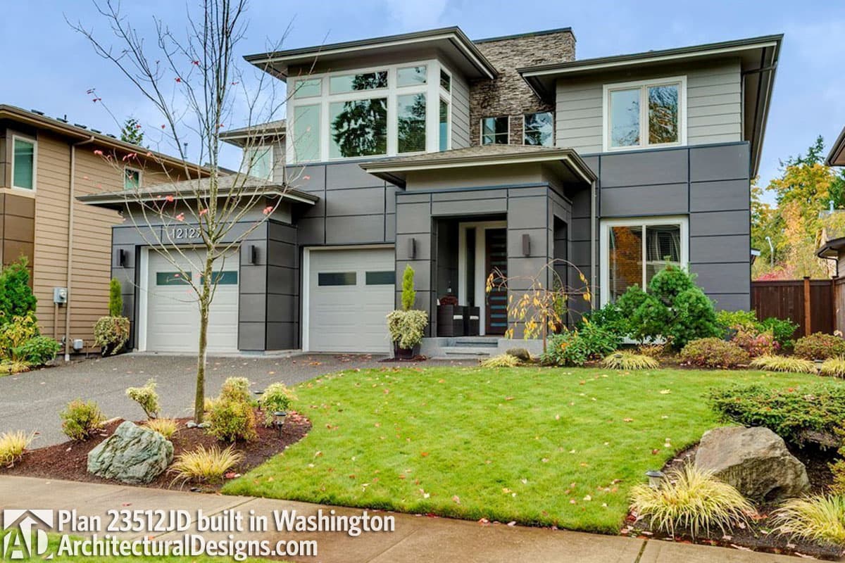 Modern house plan exterior with two-car garage, stone accents, and cantilevered upper level.