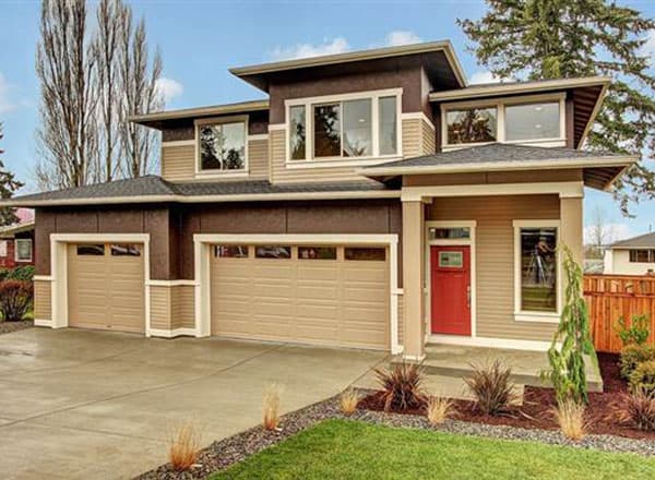House plan exterior. Two-story Modern house with a low-sloped roof, attached garage, and a covered front entry porch with a red door.