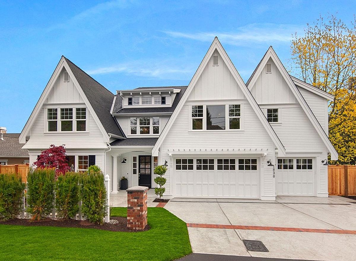 Modern Farmhouse house plan exterior with prominent gables, dormers, and a three-car garage.