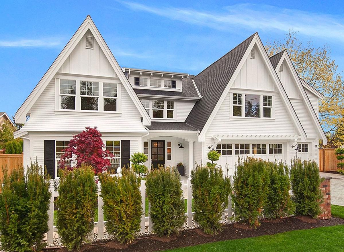 Modern Farmhouse house plan exterior with multiple gables, board-and-batten siding, and a three-car garage.