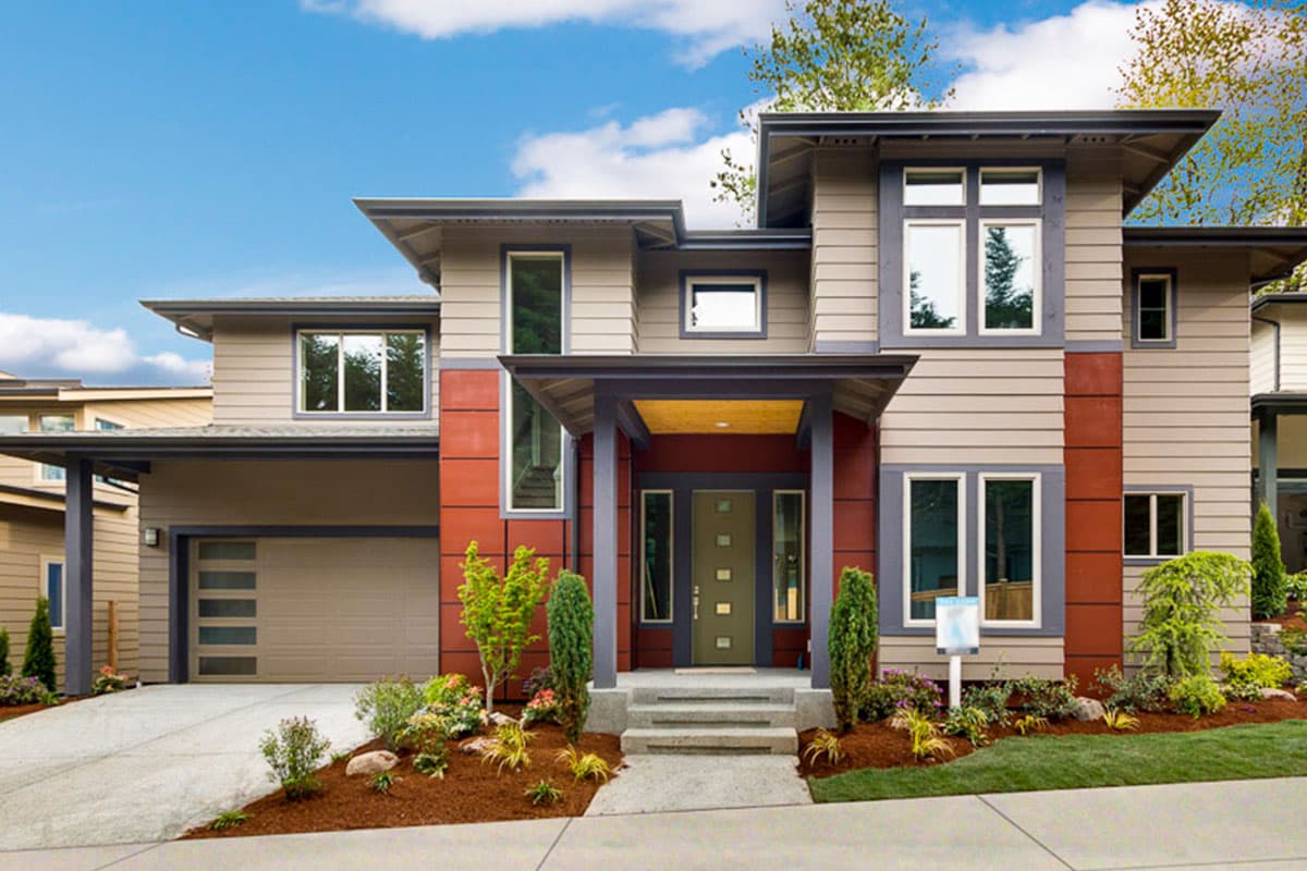 House plan exterior: two-story modern home with a covered entry, attached garage, horizontal siding, and flat rooflines.