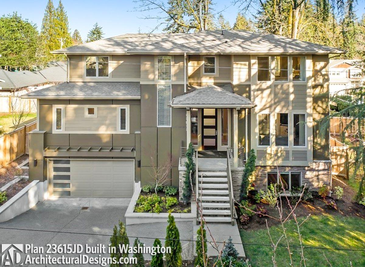 Modern two-story house plan exterior with a covered entryway, multi-pane garage door, and horizontal siding.