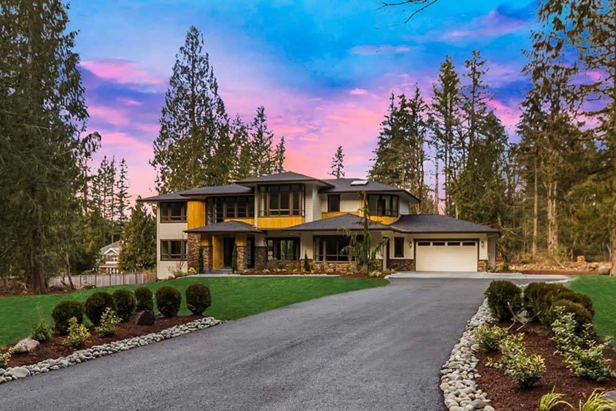House plan exterior featuring a two-story modern design. Features include a flat roofline, multi-pane windows, and attached garage with a driveway.