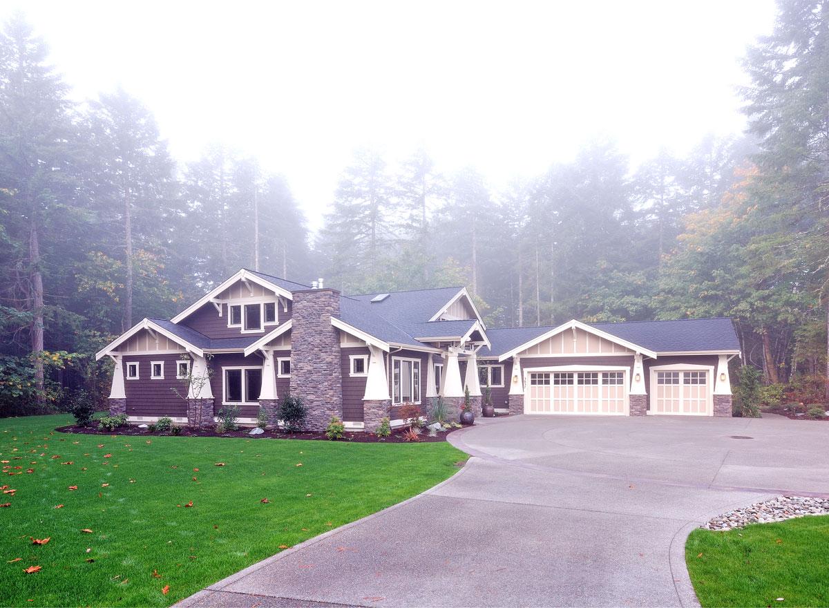 Craftsman style house plan exterior with a stone chimney, gabled dormers, and a three-car garage.