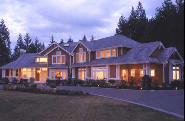 Craftsman style house plan exterior with multiple gables, dormers, a covered porch, and stone accents.
