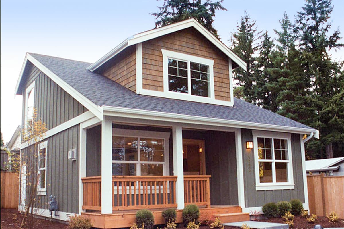 House plan exterior: Two-story cottage with covered porch, gabled dormer, and vertical siding.