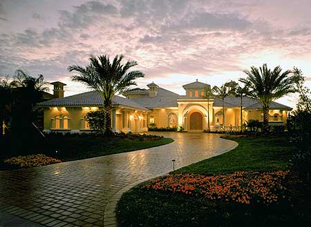 House plan exterior: Single-story Mediterranean style with arched entryway, tile roof, and prominent cupola.