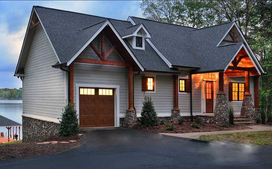 Craftsman house plan exterior with a side-entry garage, stone base, exposed rafters, and multiple gables.