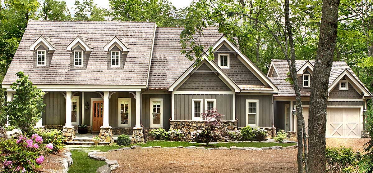 House plan exterior: Two-story Craftsman home with a covered porch, stone accents, multiple gables, and a two-car garage.