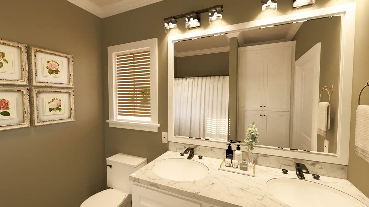 A modern bathroom features a marble countertop with two sinks beneath a large mirror, a window with blinds, and framed floral artwork.
