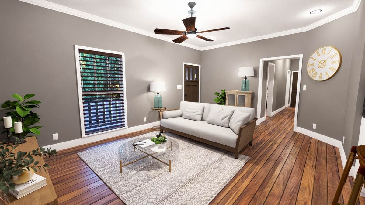 Living room with light gray walls, wood floor, large window with blinds, sofa, coffee table, and ceiling fan.