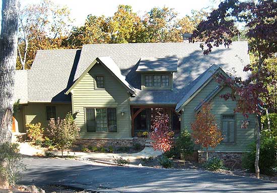 Craftsman style house plan exterior with multiple gables, dormers, stone foundation, and covered entry.