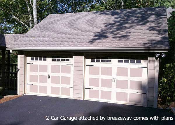 Two-car garage with carriage-style doors, clerestory windows, and attached breezeway, shown in house plan exterior.