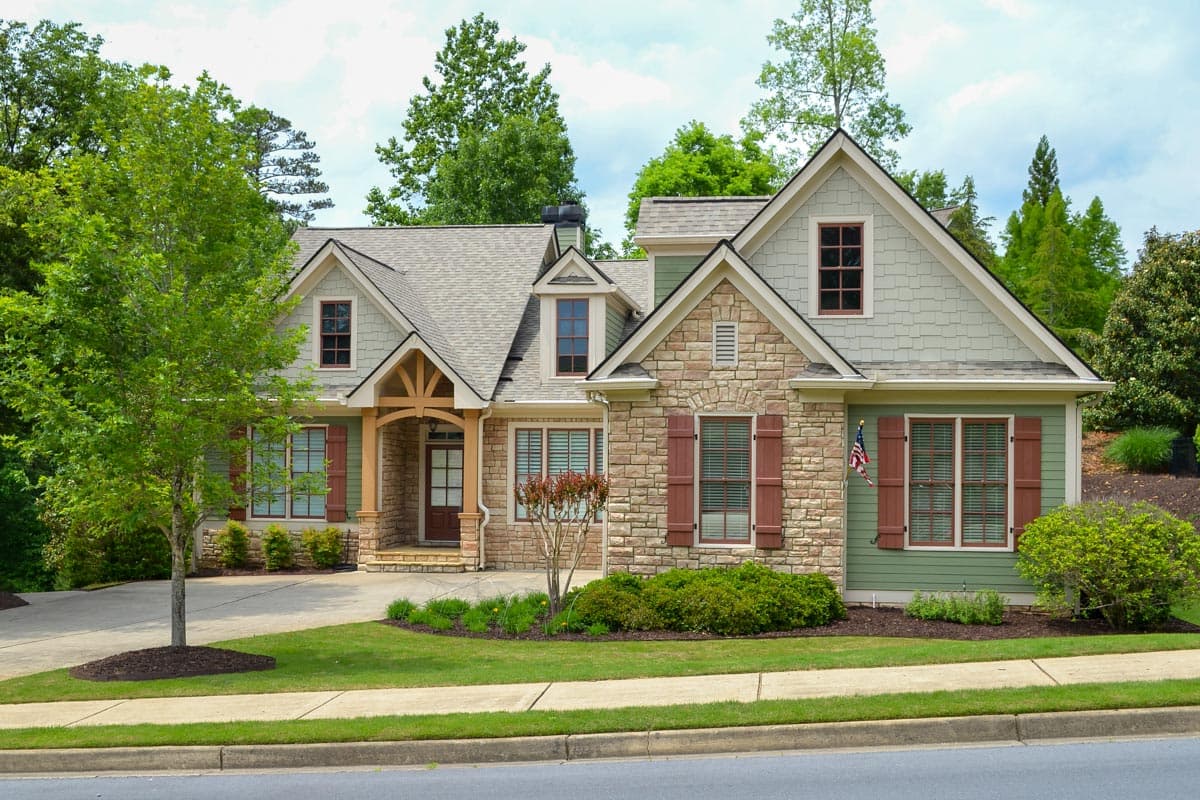 House plan exterior shows a two-story Modern Farmhouse with stone accents, gables, dormers, and a covered entry porch.