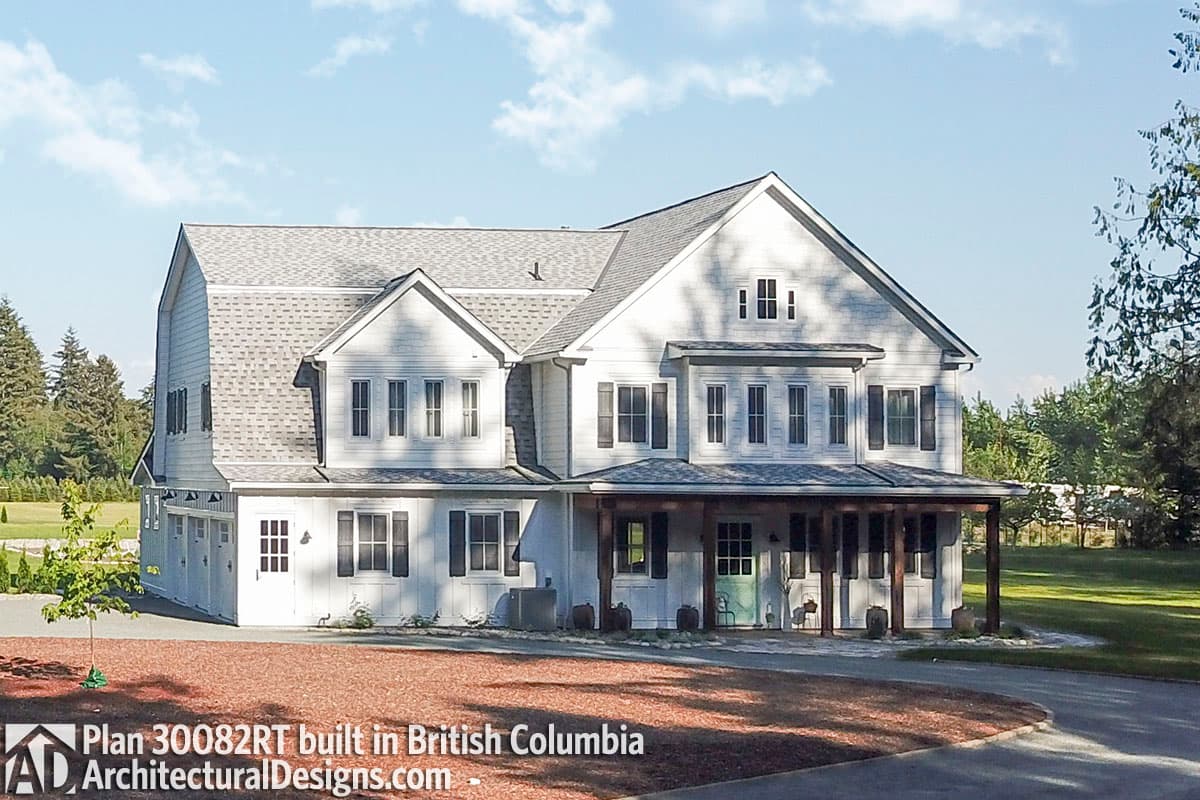 House plan exterior: two-story Modern Farmhouse with multiple gables, covered porch, and attached garage.