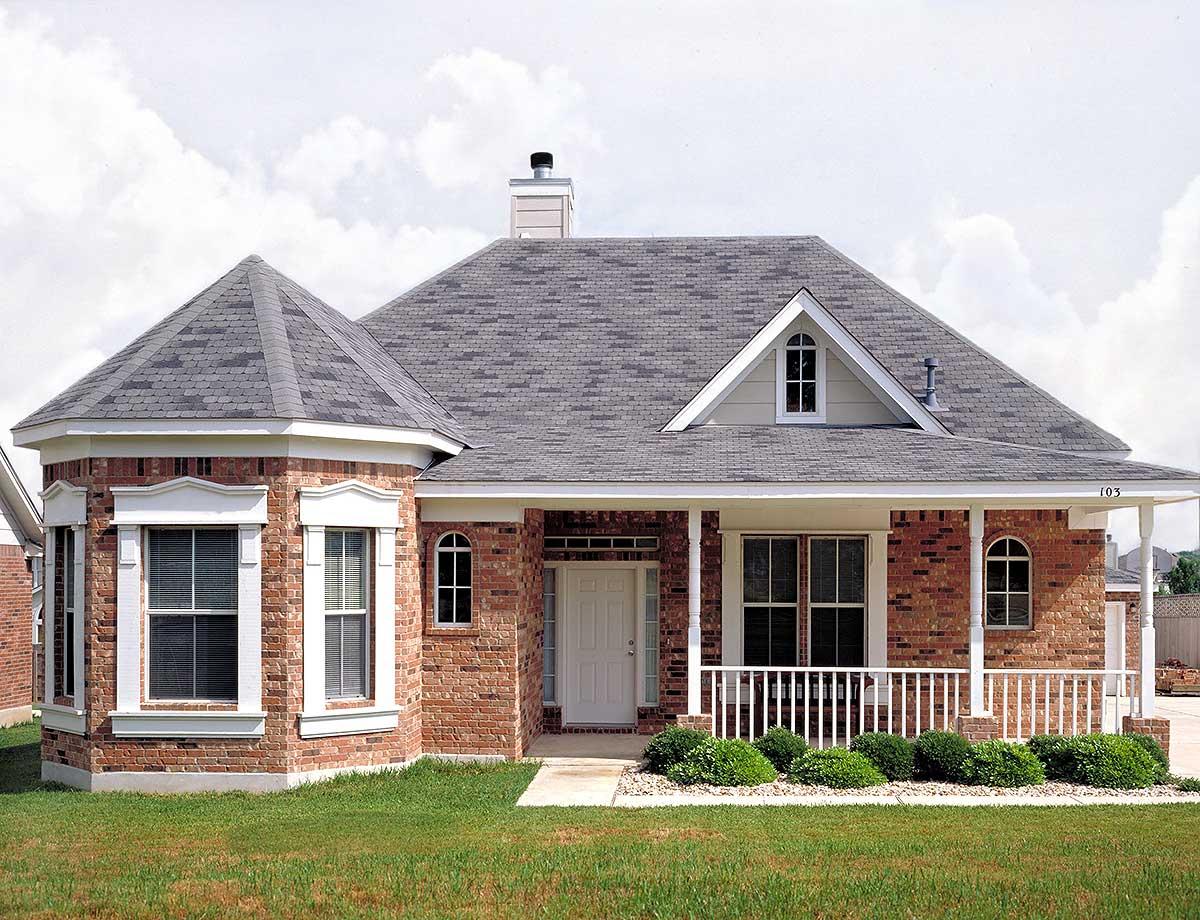 House plan exterior: One-story brick home with prominent octagonal bay windows, covered front porch, gable dormer, and arched windows.