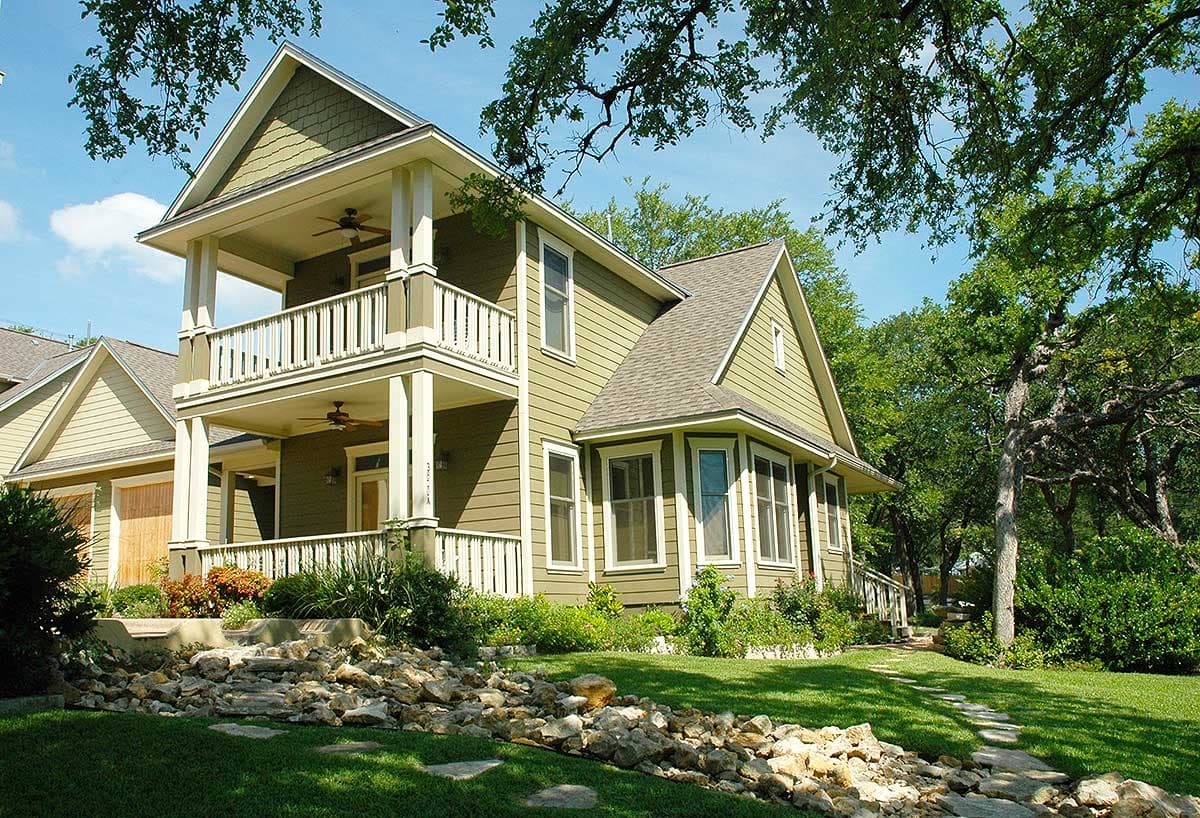 Two-story house plan exterior with a double-decker porch, gables, and a bay window.