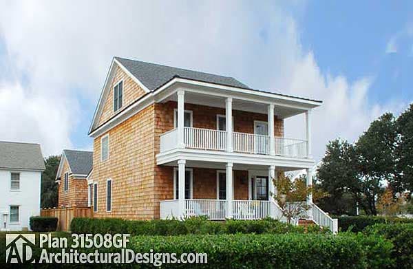 Two-story house plan exterior with cedar shake siding, a prominent double-decker porch, and a prominent gable dormer.