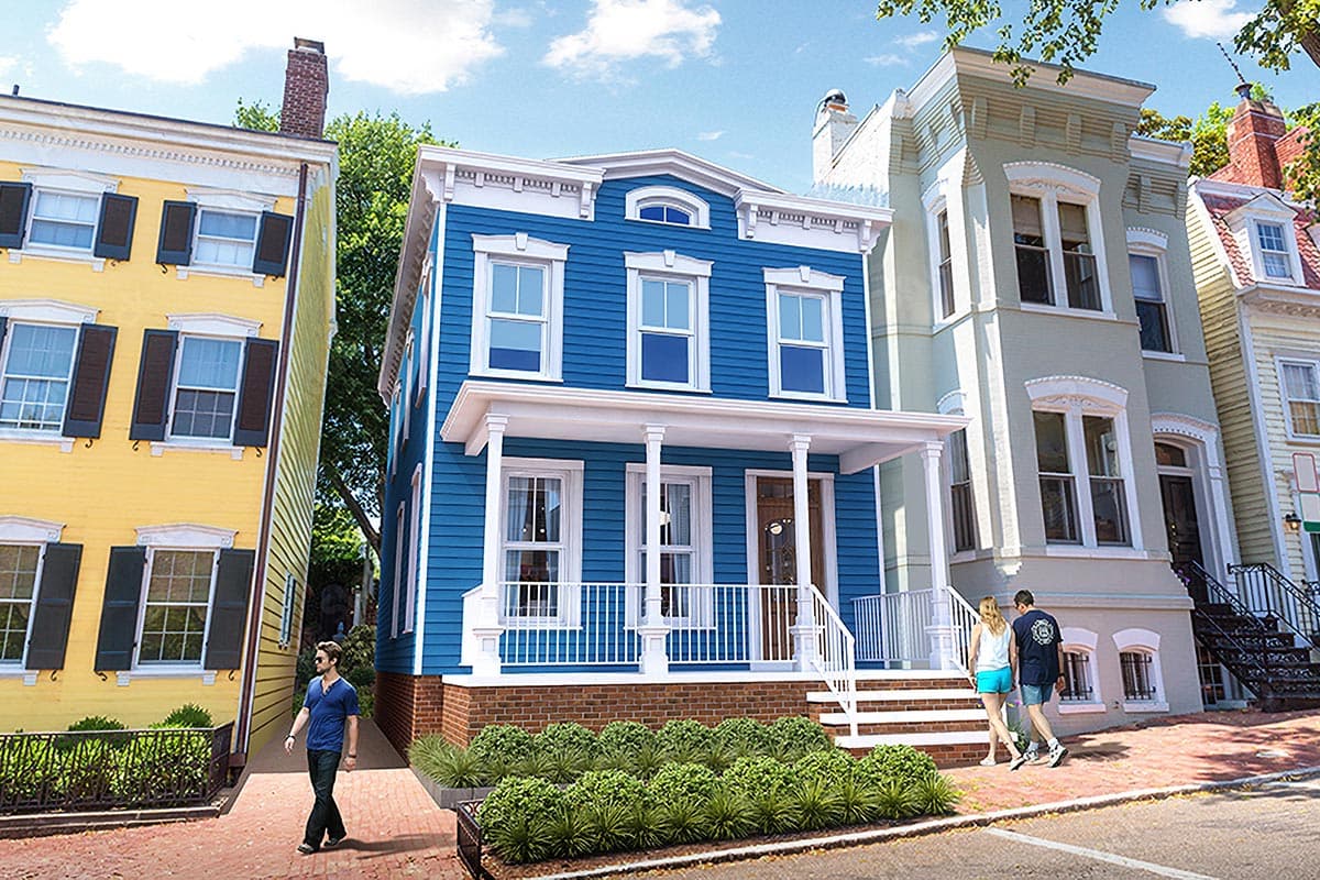 House plan exterior. Three-story home with a front porch supported by columns. Features include a gable roof and detailed cornice work.
