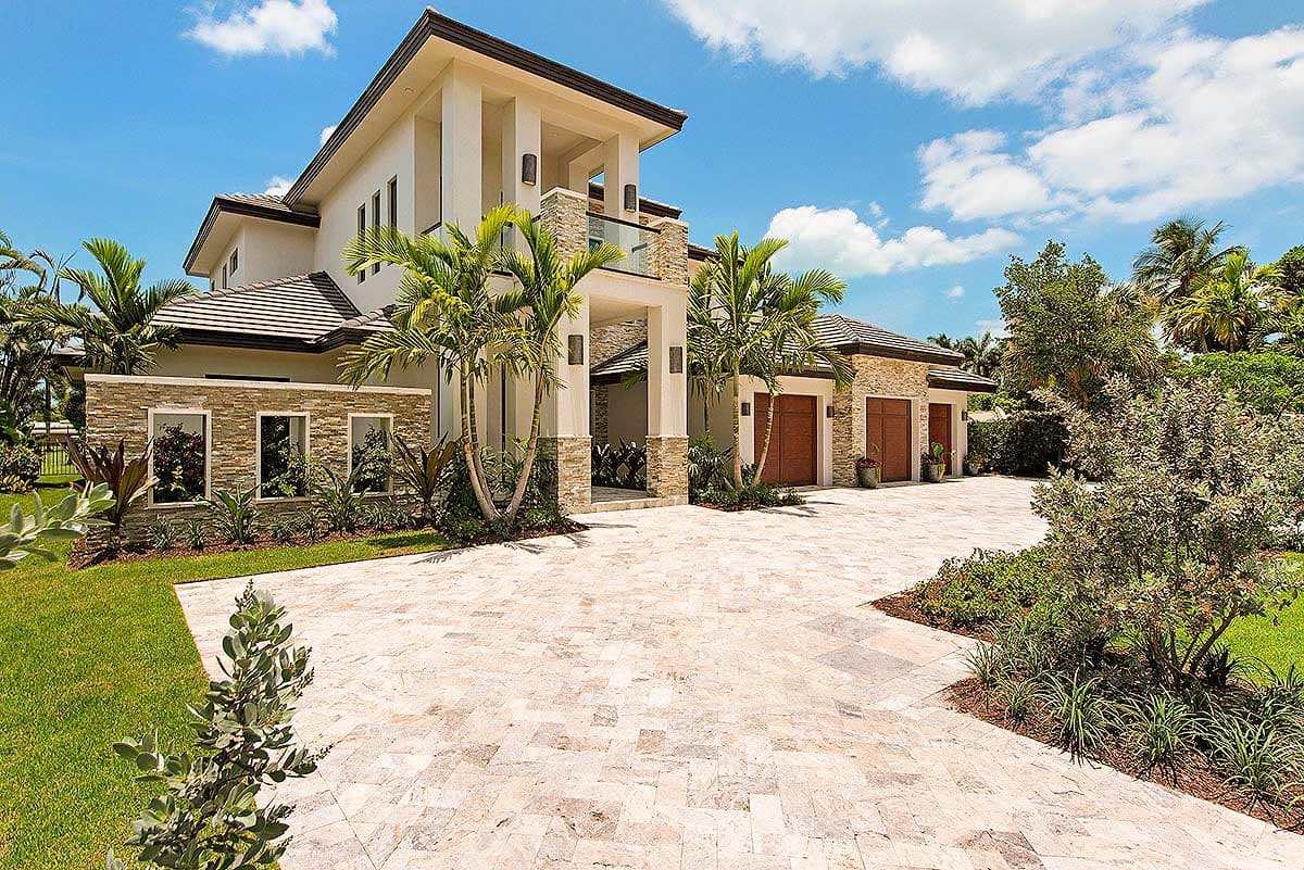 House plan exterior with two stories, flat roof, stone accents, and a covered entryway. Attached garage with wood doors.