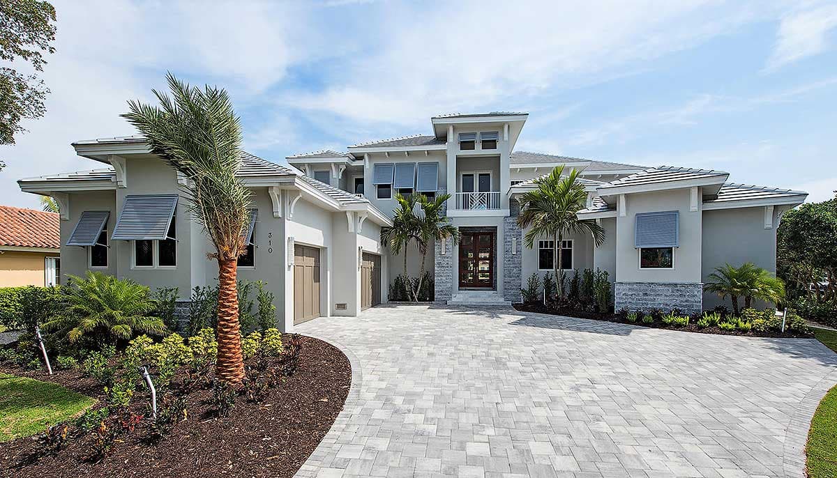 House plan exterior featuring a two-story design with a modern style. Notable features: multiple gables, shuttered windows, and a detached garage.