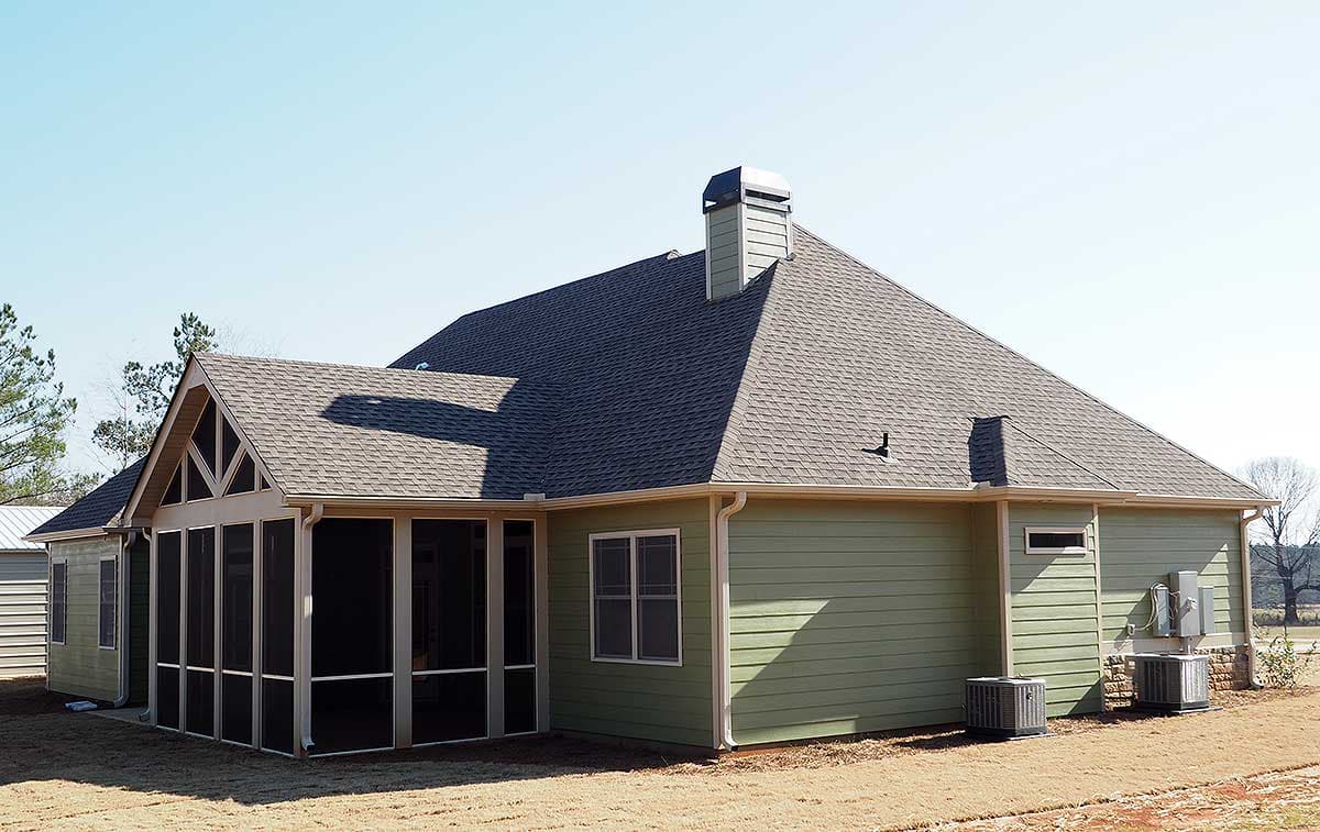 House plan exterior with screened porch, gabled dormer, and attached garage. Features siding, brick base, and multiple rooflines.