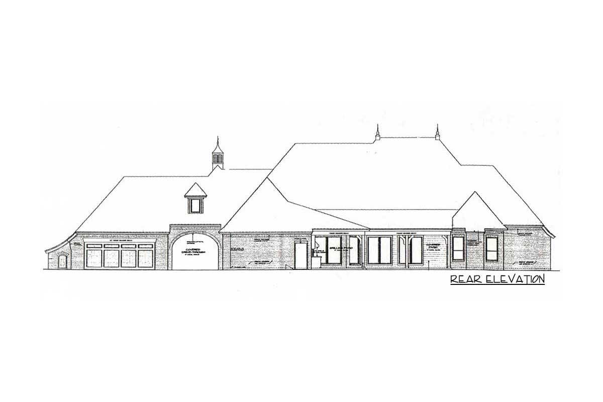 Rear elevation drawing of a house plan with a prominent roofline, covered drive-through, dormer, and multiple windows.