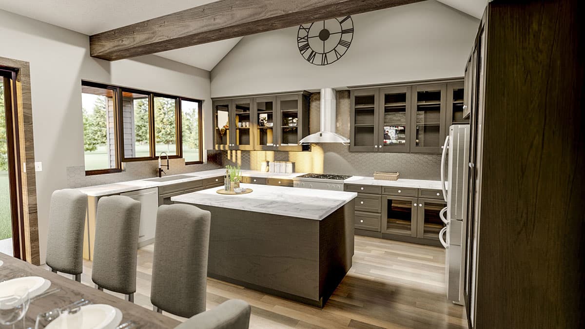 Kitchen interior with vaulted ceiling, exposed beams, large island with marble countertop, and dark cabinetry.