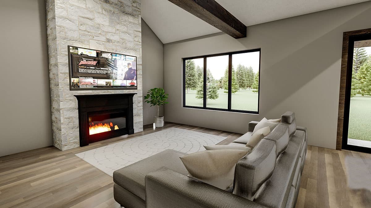 Living room with stone fireplace, vaulted ceiling with wood beam, large window, and sectional sofa.