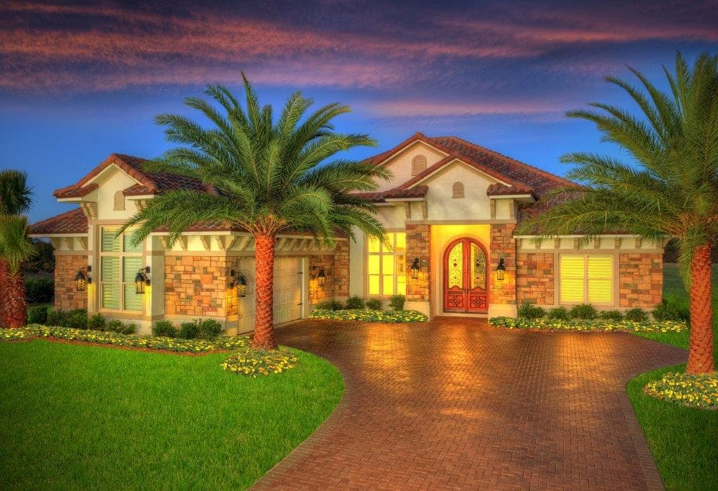 House plan exterior: Mediterranean style, single-story, with arched entry, tile roof, stone accents, and a three-car garage.