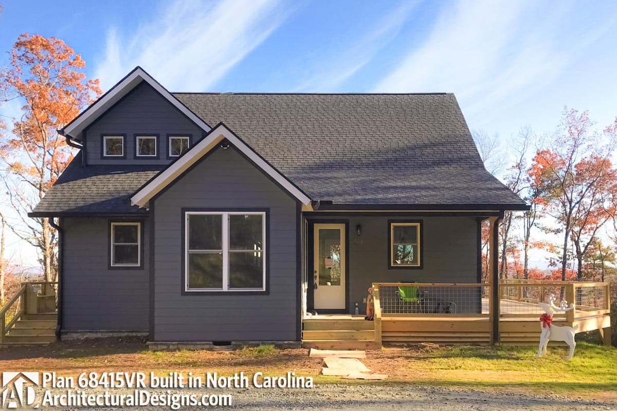 House plan exterior: Modern style, two stories, gabled roof, dormer with three windows, and a covered front porch.