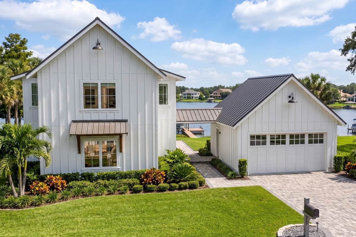 Modern Farmhouse house plan exterior with two stories, white vertical siding, gables, black-framed windows, and attached garage.