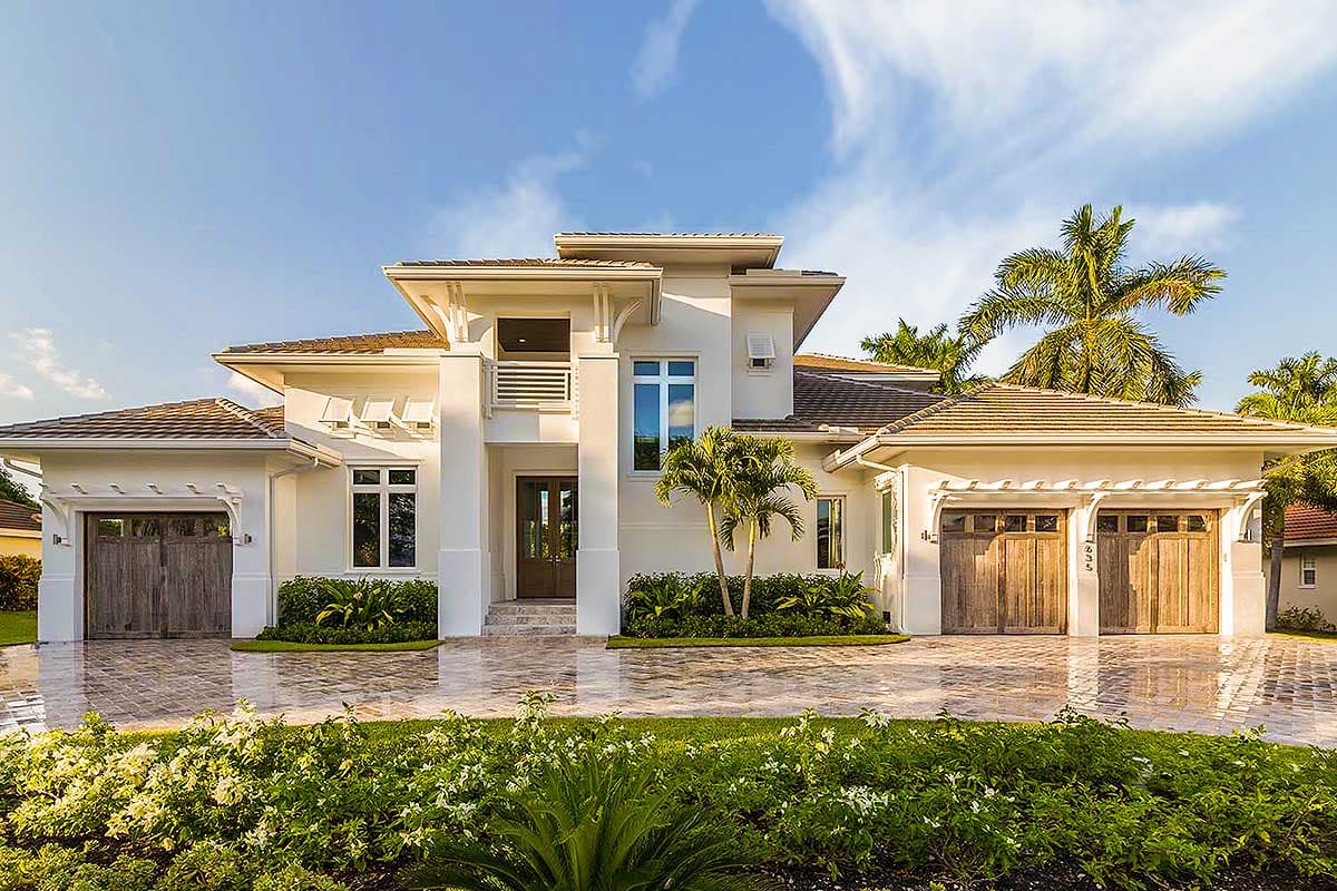 Modern house plan exterior with two-car garage, flat rooflines, wood garage doors, and stucco finish.
