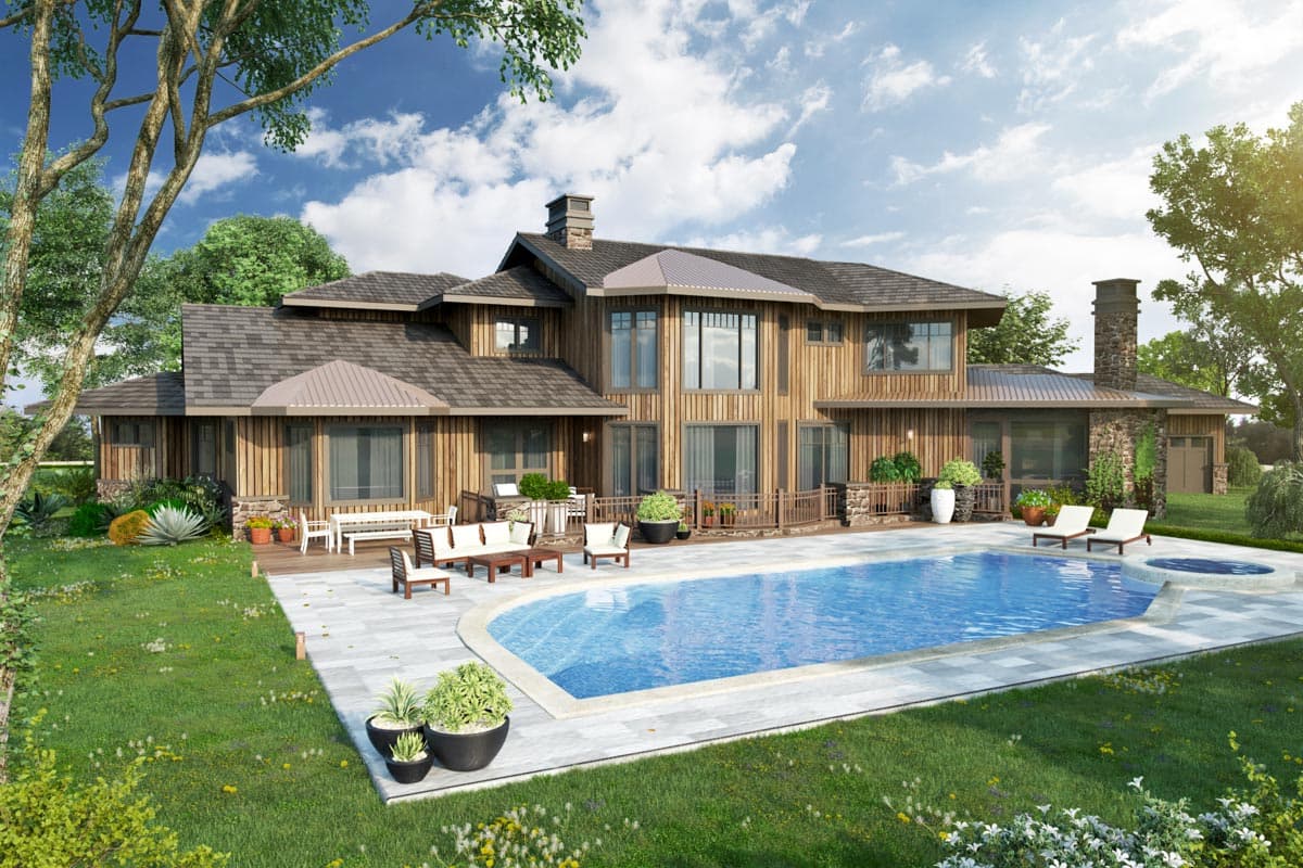 House plan exterior: Two-story wood-clad home with gabled roof, stone chimney, and extensive decking with pool.