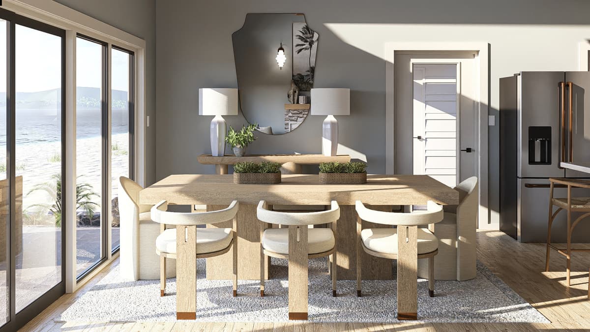 Dining area with a wood table, upholstered chairs, and sliding glass doors overlooking the ocean.