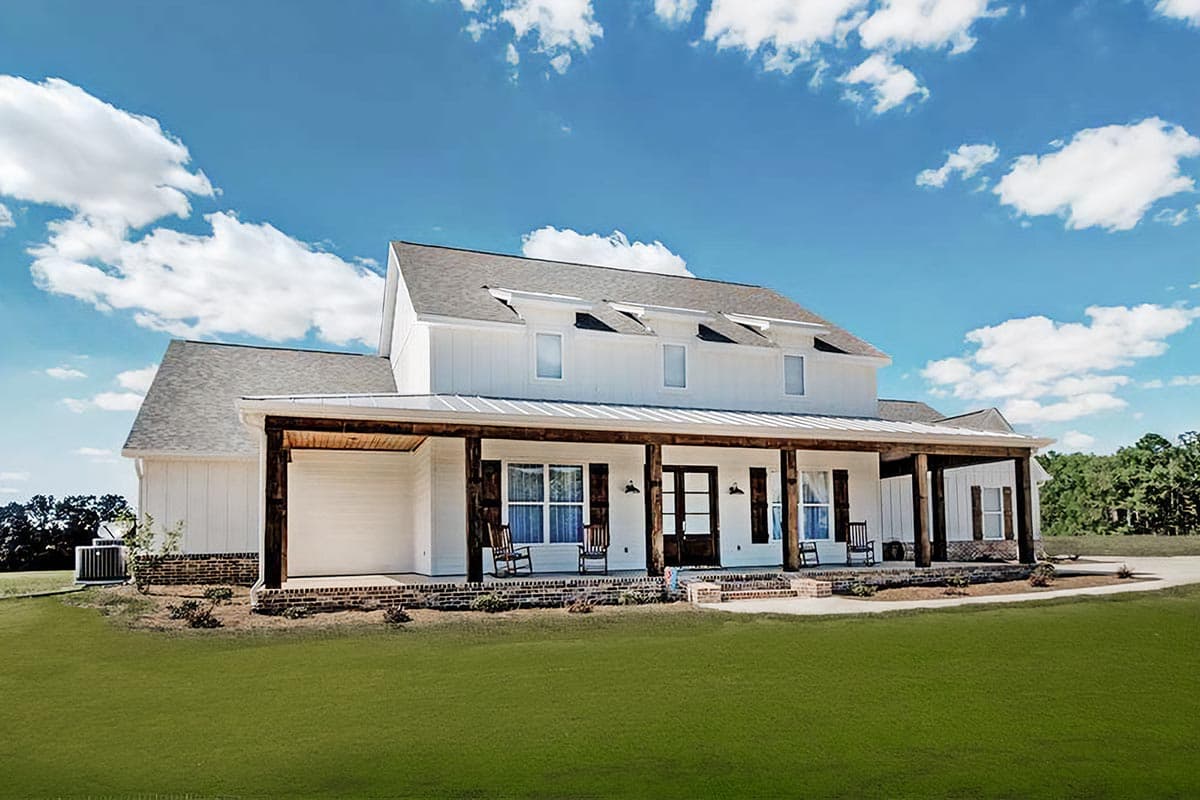 House plan exterior. Two-story Modern Farmhouse with a large porch, gable roof, and three dormers above the porch.