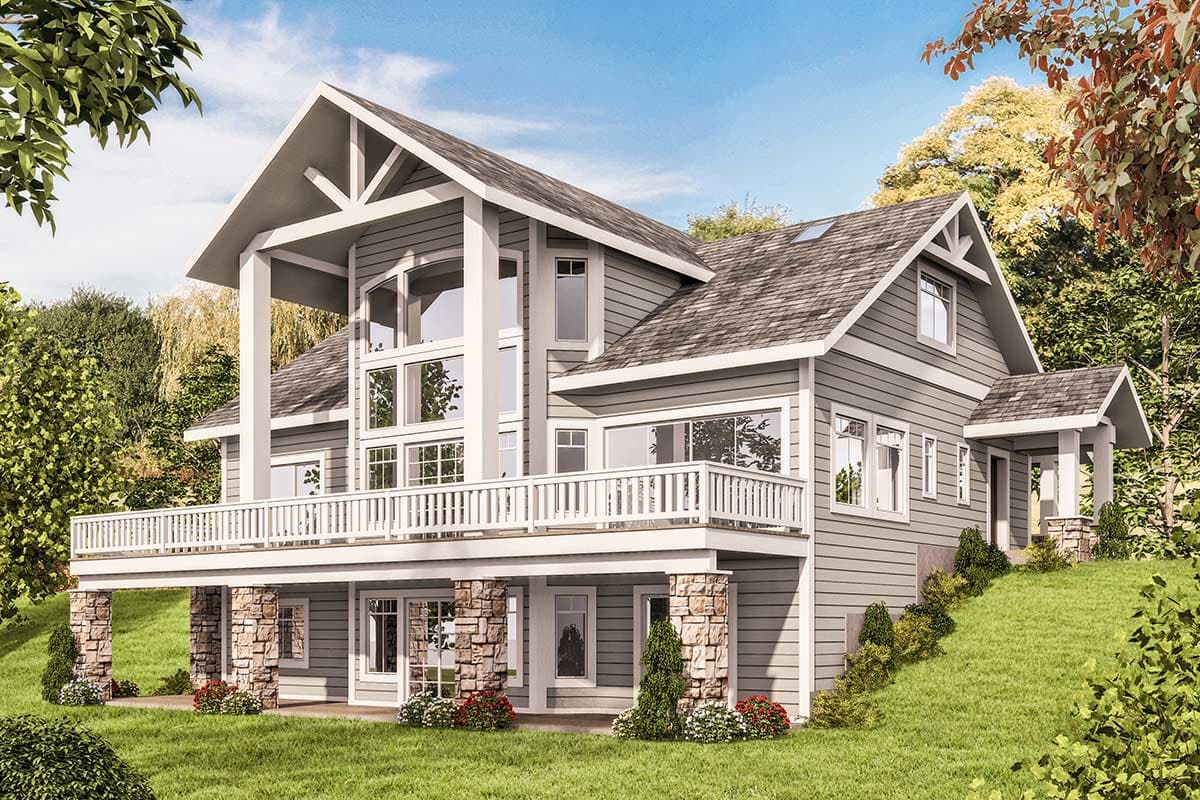 House plan exterior with gable roof, stone-clad columns, extensive deck, and large multi-pane windows.