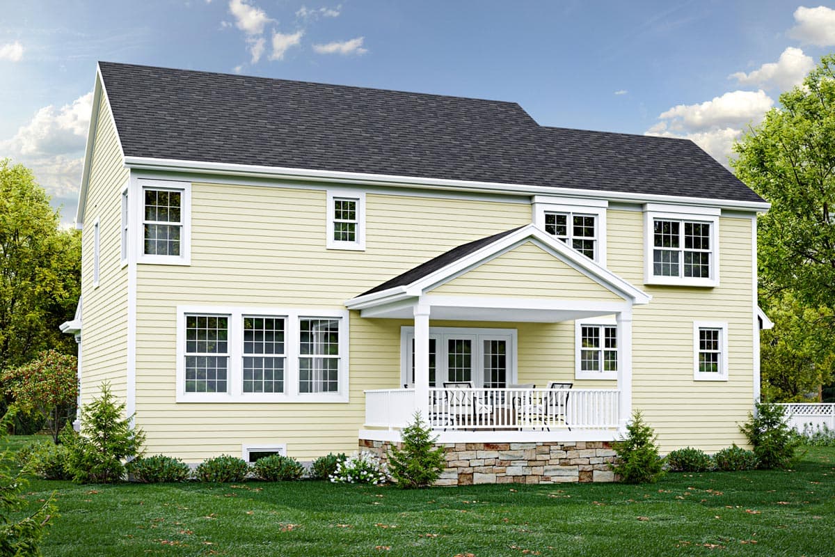 Two-story house plan exterior with a covered porch, white railings, multiple windows, and light yellow siding.