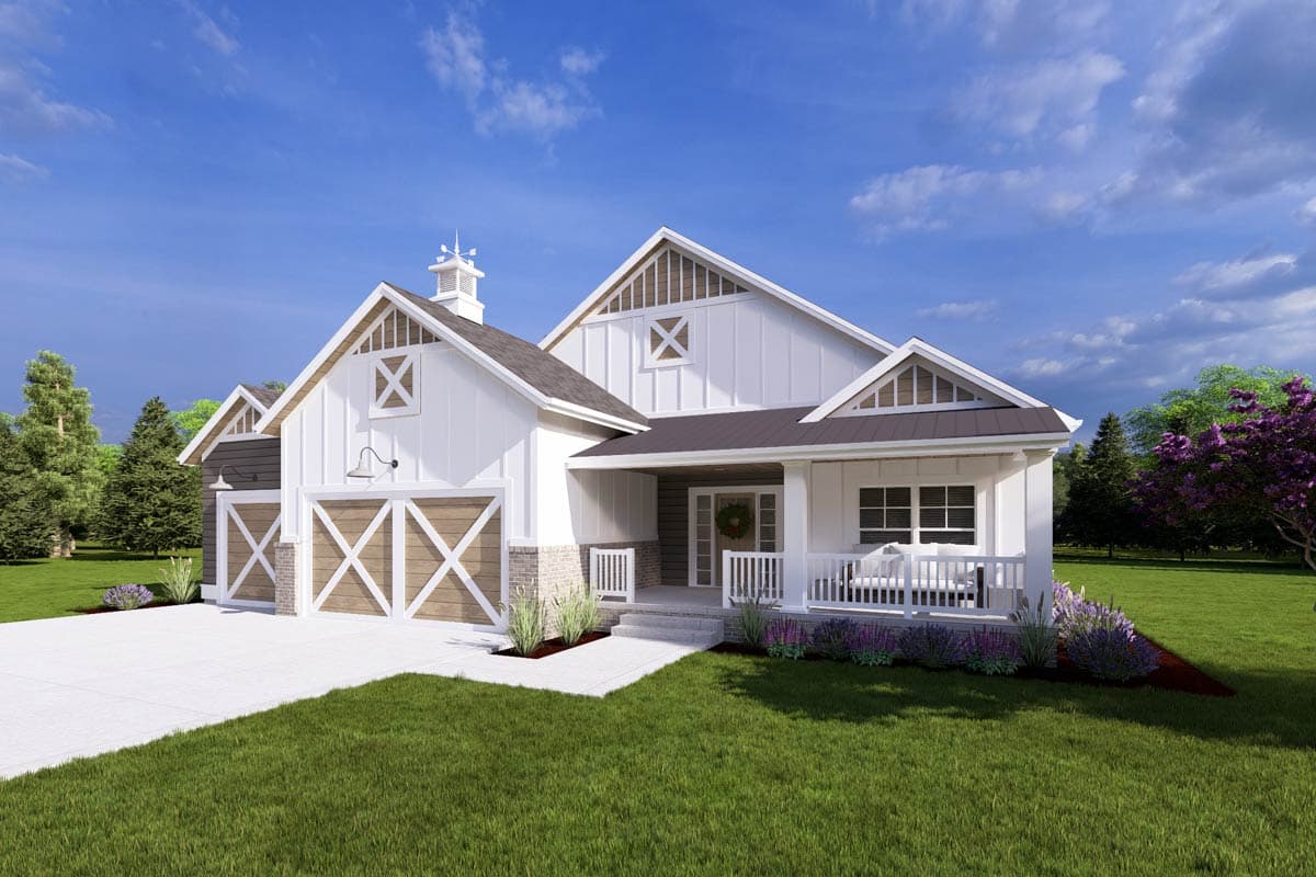 A modern farmhouse with white siding, dark trim, and a porch, set against a blue sky with green grass and landscaping in the foreground.