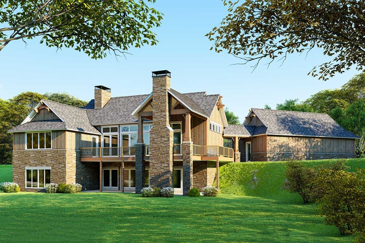 House plan exterior: two-story home with stone and wood siding, large windows, multiple gables, and a prominent stone chimney.