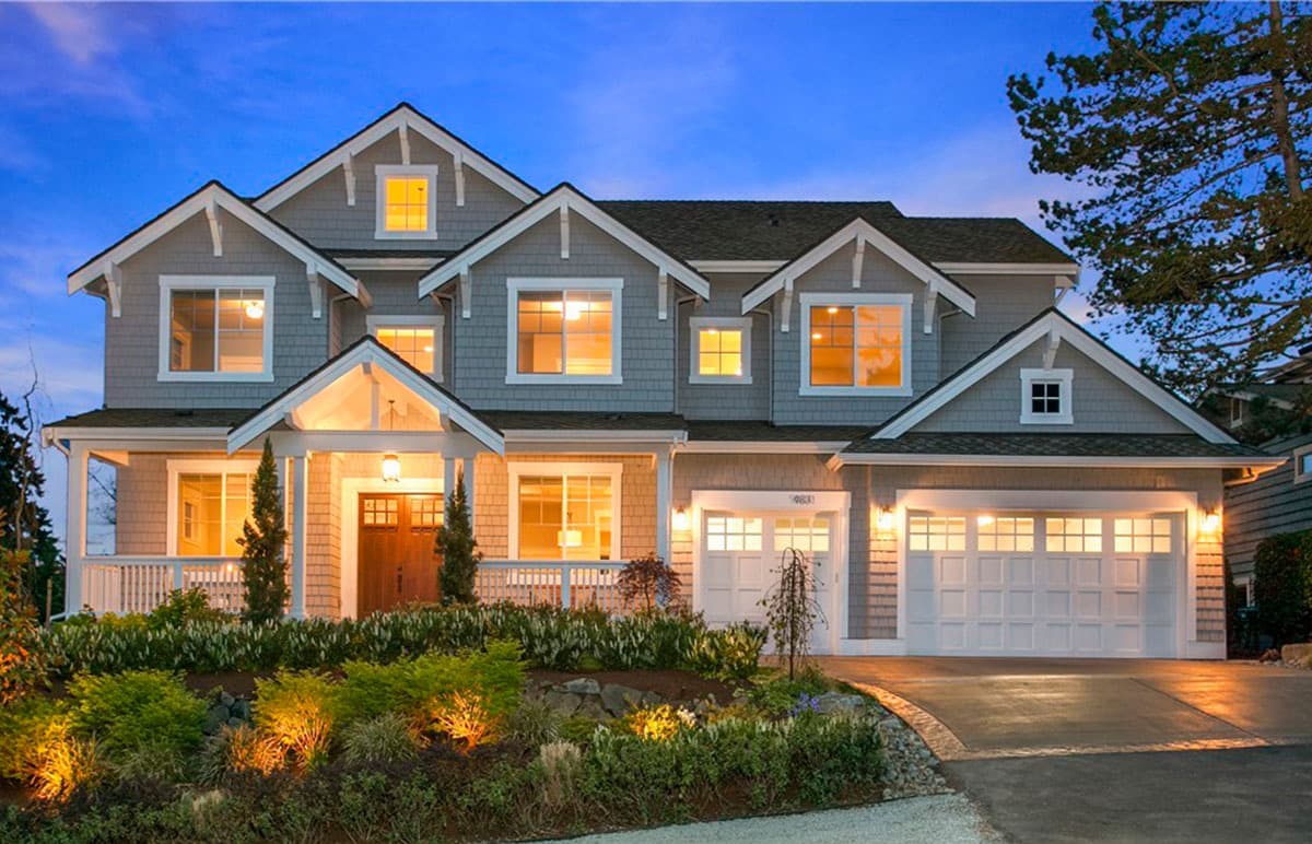 House plan exterior, two stories, siding, gables, dormers, covered porch, and a side-entry garage.