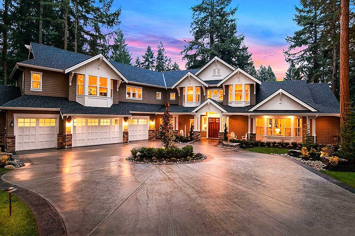 House plan exterior: Two-story home with five garage bays, multiple gables, and a covered front entryway.