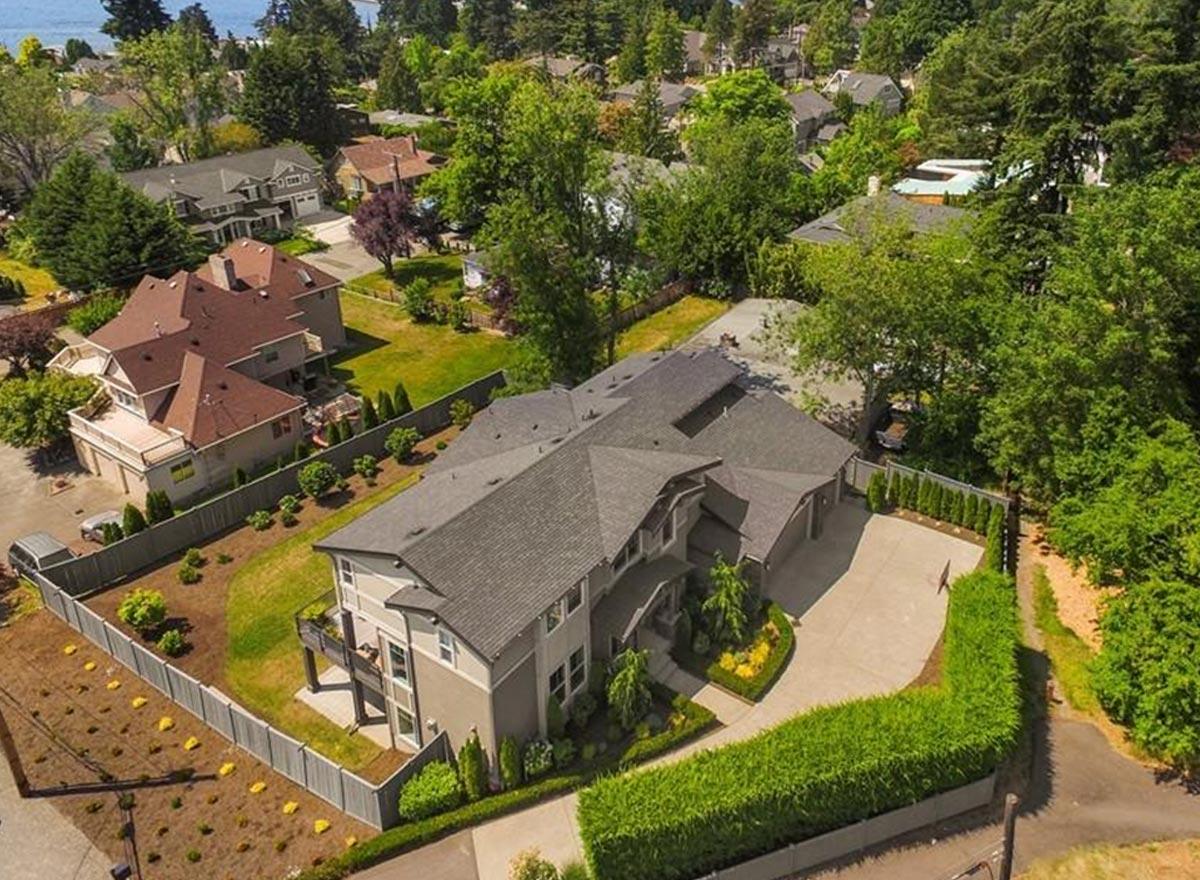 House plan exterior featuring a Modern style, two stories, prominent gables, and attached garage.