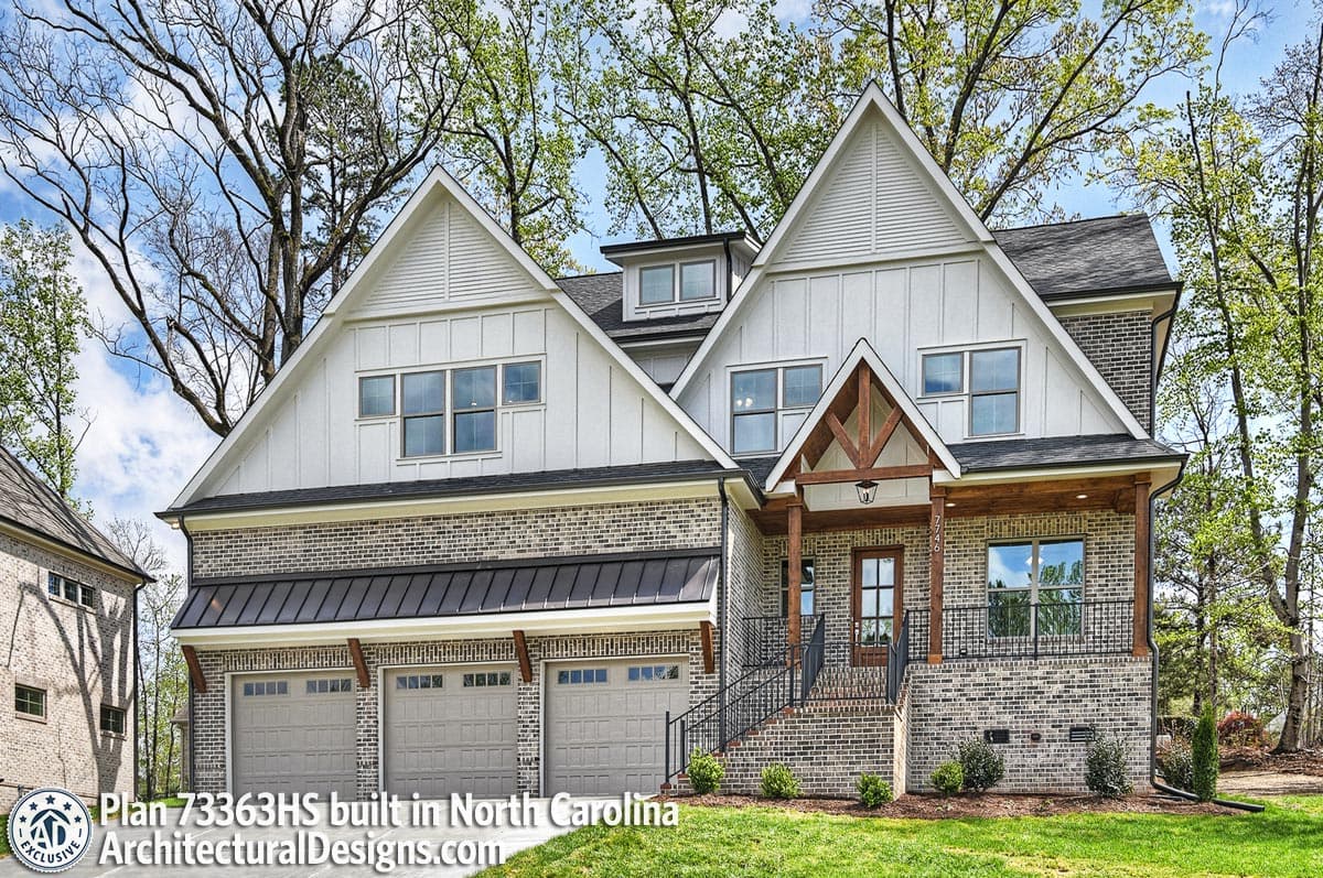 House plan exterior: Modern Farmhouse style, two stories, multiple gables, wood-framed porch, metal roof over garages.