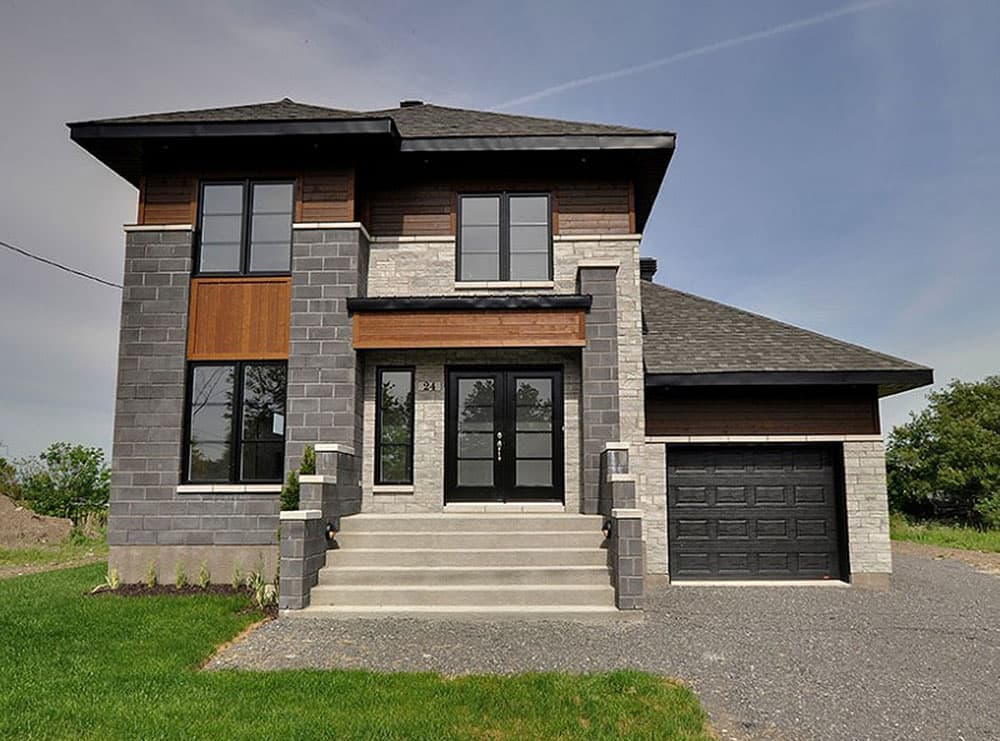 Modern two-story house plan exterior with stone and wood siding, double front doors, large windows, and attached garage.