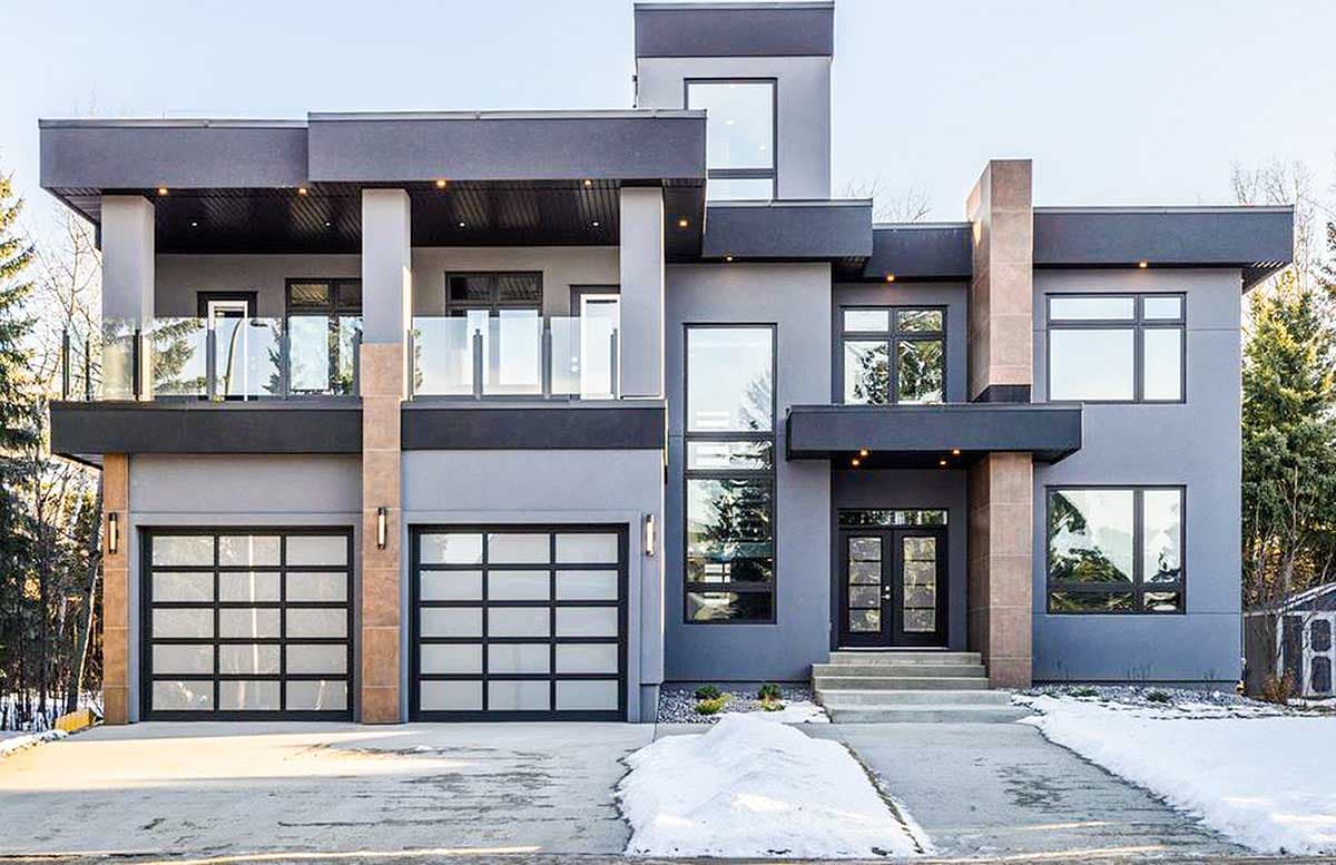 House plan exterior. Modern style, two-story home with flat roof, glass-paneled garage doors, and a second-story balcony with glass railings.