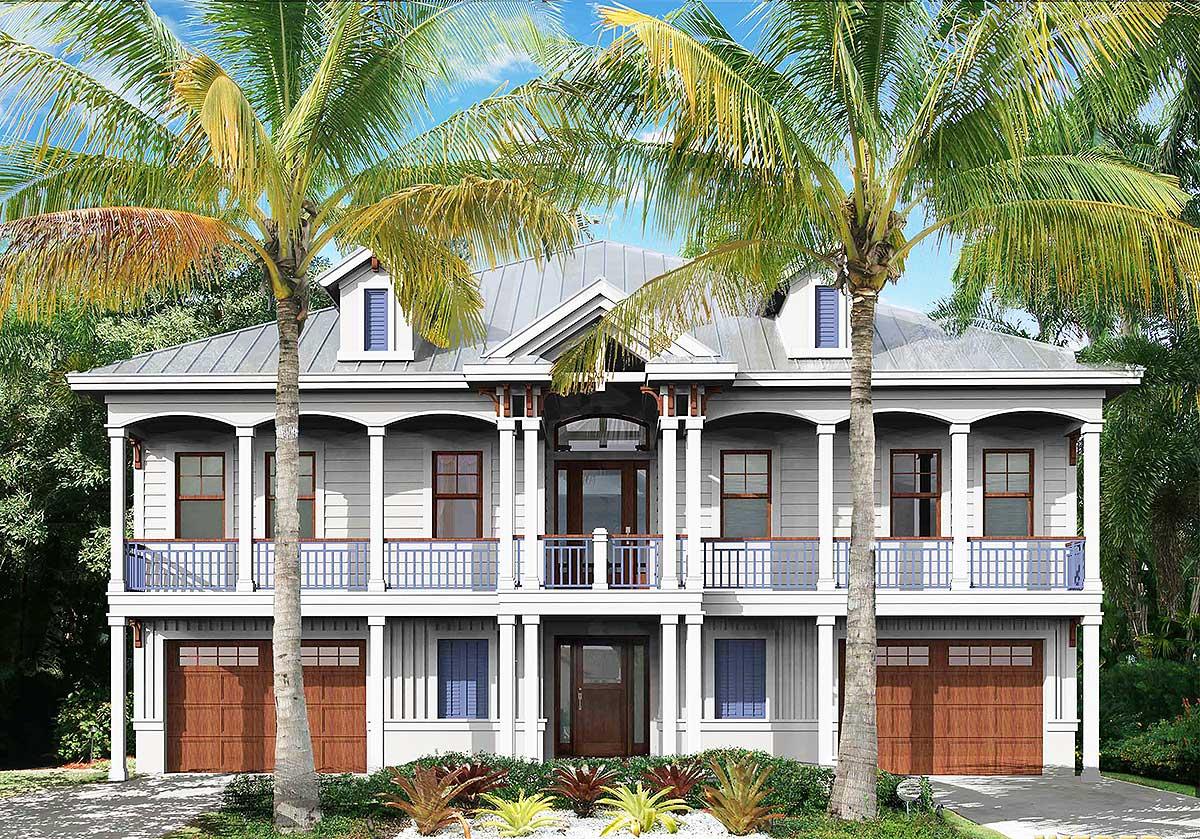 House plan exterior: two-story Coastal style with gabled dormers, covered balconies with railings, and double garages.